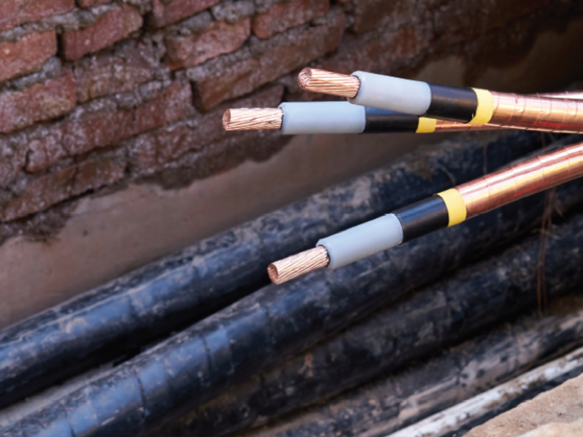 Cables near a brick wall