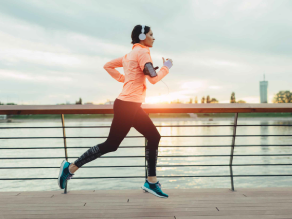 Woman running by water