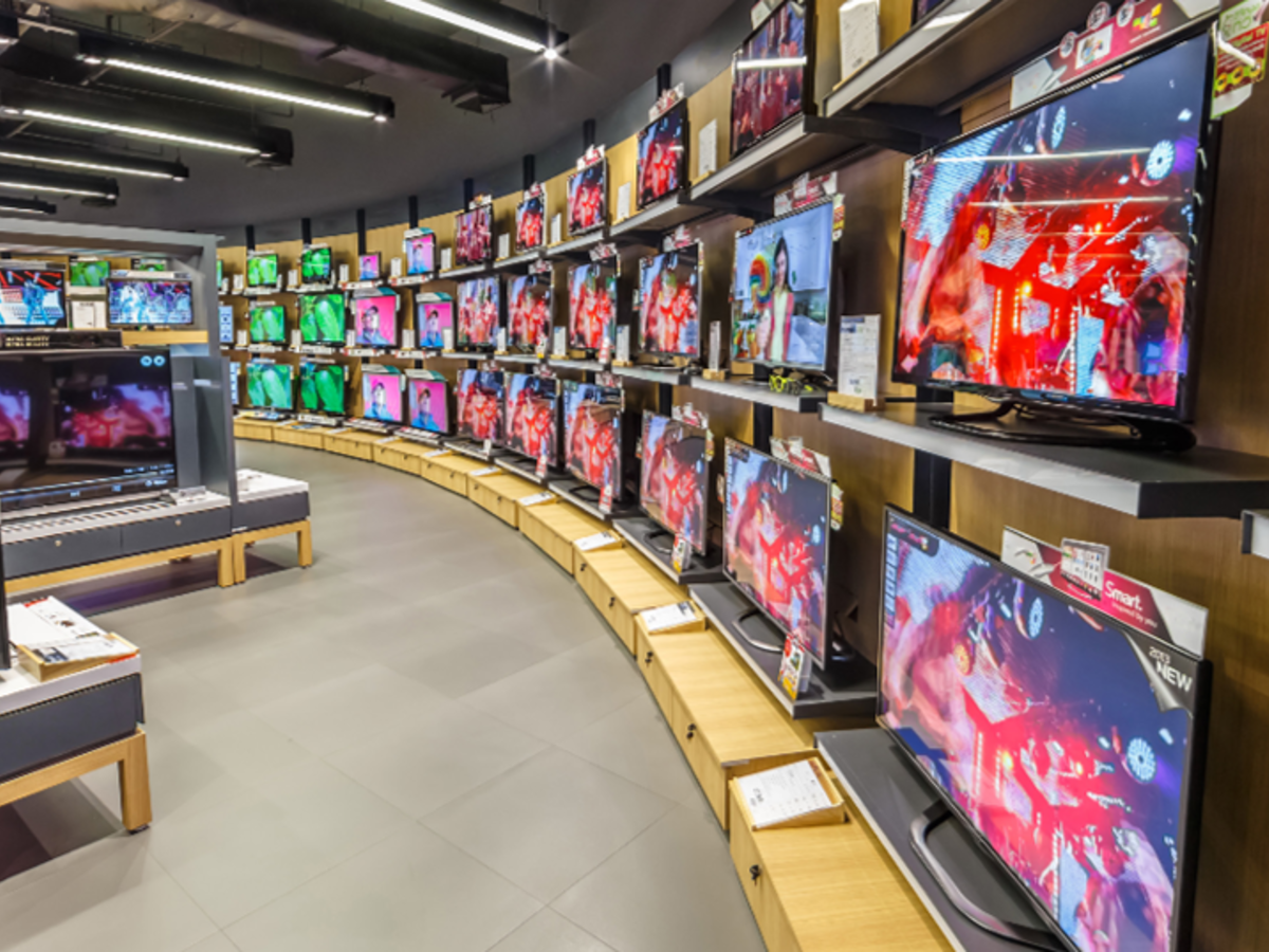 A wall of TVs in an electronics store. 