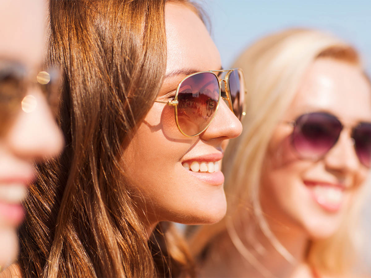 Three women wearing sunglasses