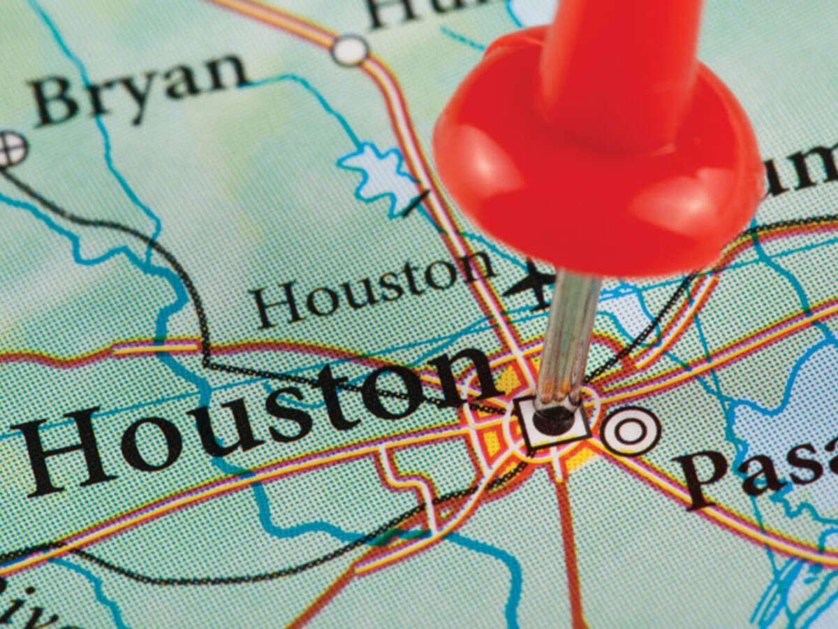 Map with Houston, Texas pinned by a thumb tack 