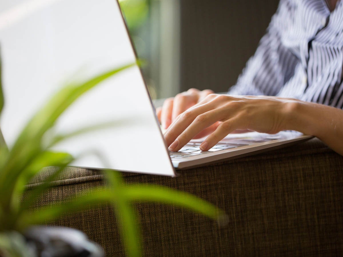 Close up of laptop on person's lap