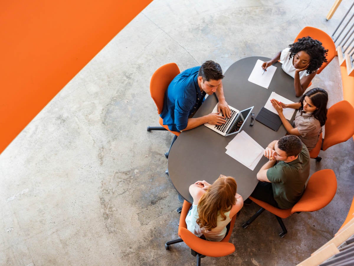 Overhead image of persons at a conference table