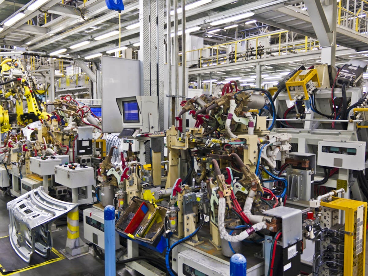 Robotic machines in a factory setting. 
