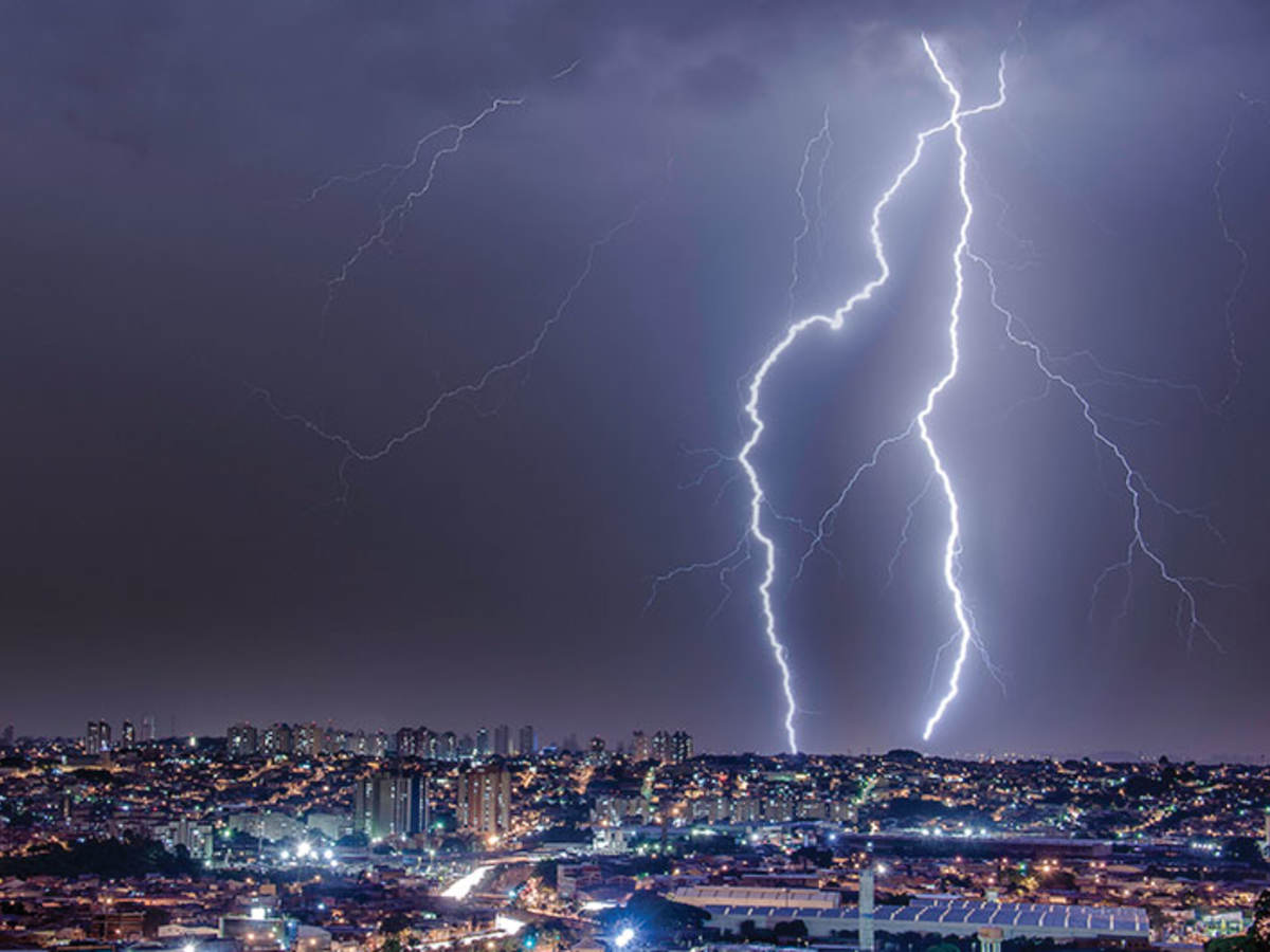 Lightning striking cityscape