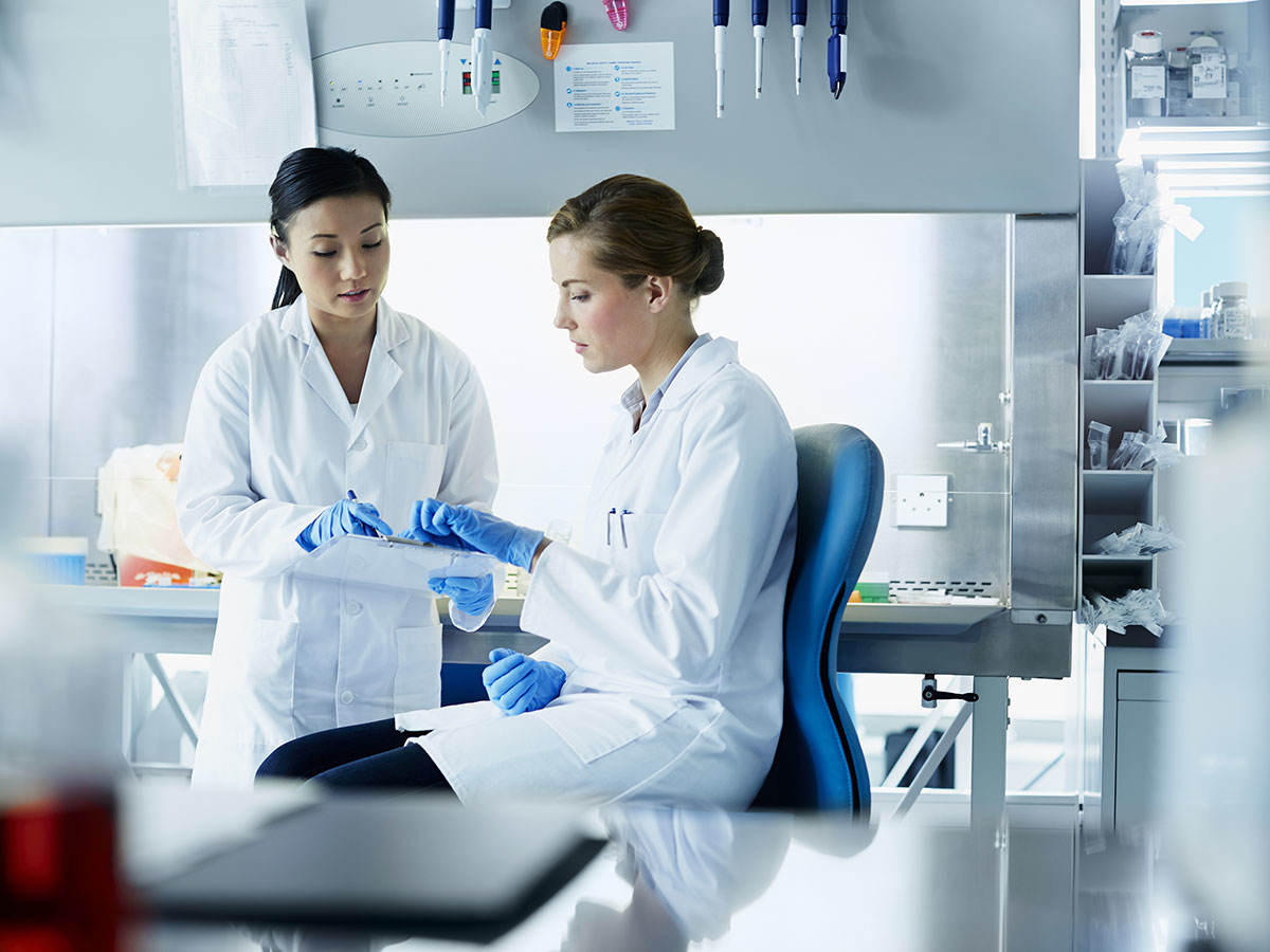 Two scientists in a lab working