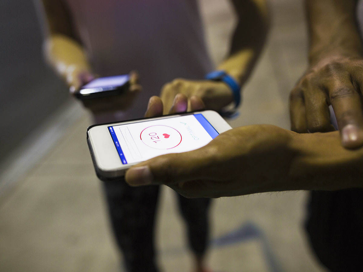 Two people using an app to check their health