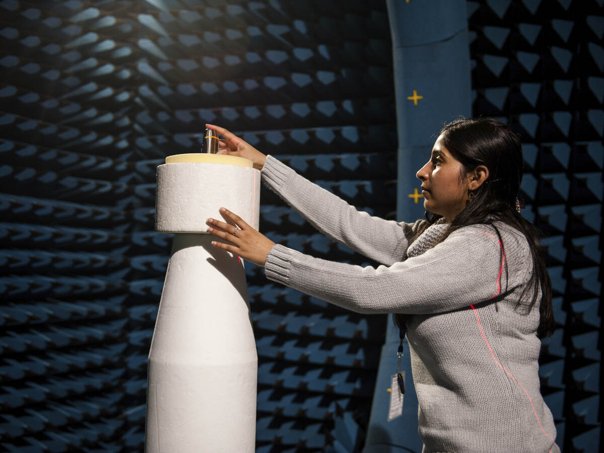 Young girl exploring a large white connected device