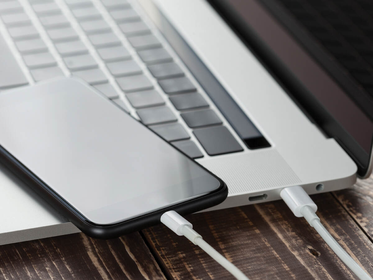 laptop and mobile phone with charging cables