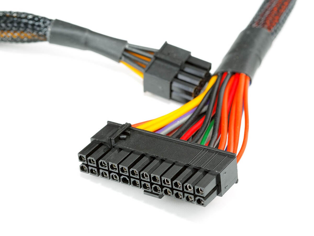Connecting wires to a computer on a white background, part of a wiring harness traceability program