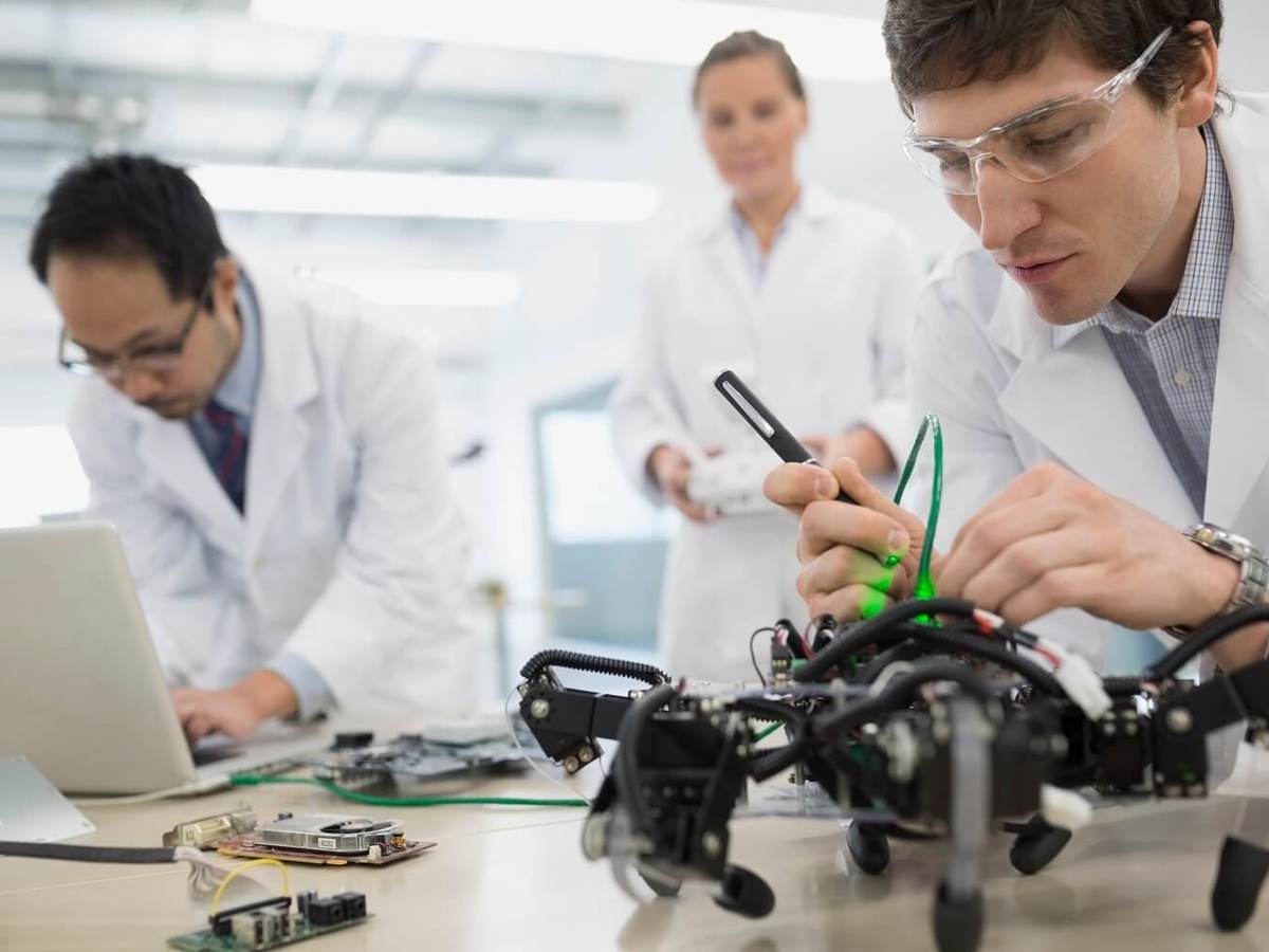 Laboratory technicians examine the battery safety packs of a drone.
