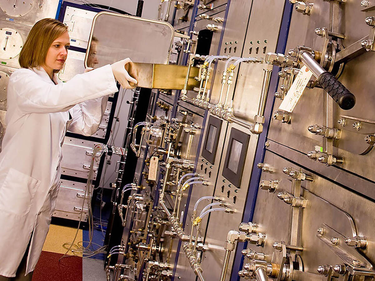 Female scientist working with equipment