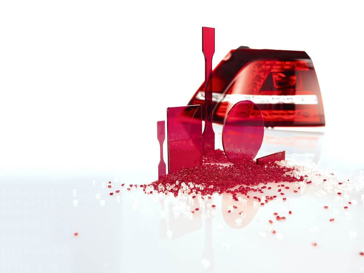 Several red plastic pieces that are about to undergo materials testing.