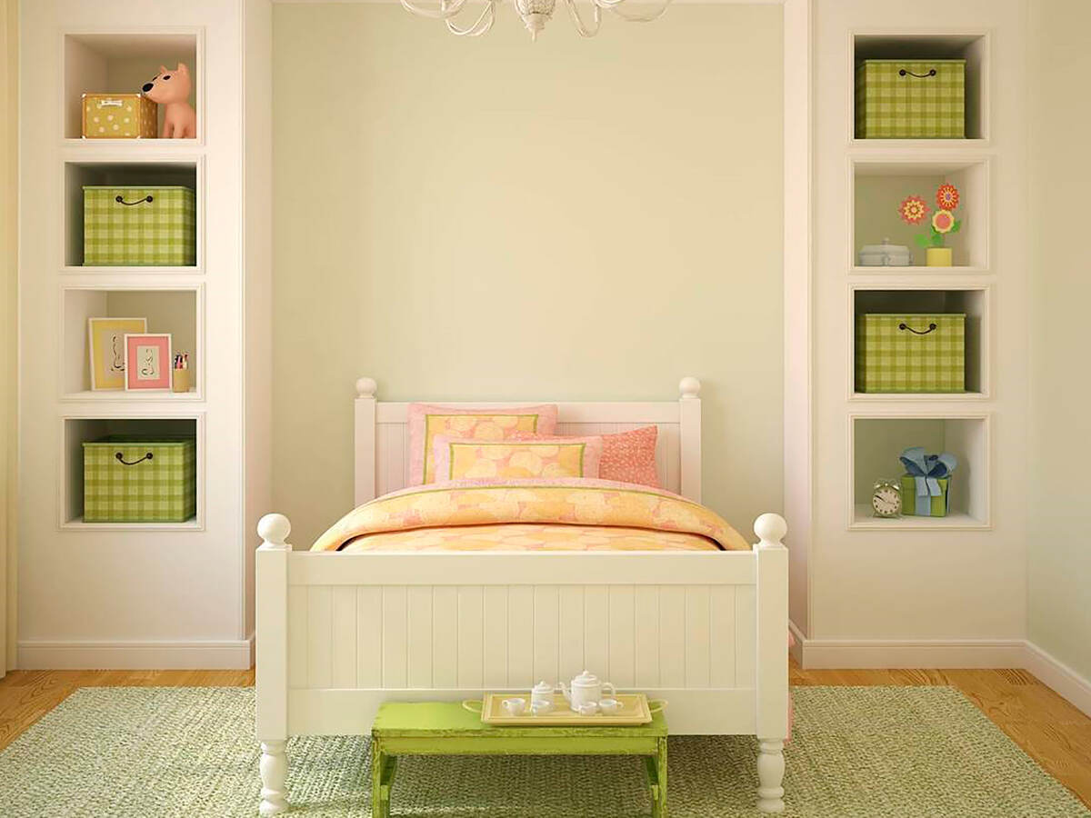 Child’s bedroom with bed and bookshelves
