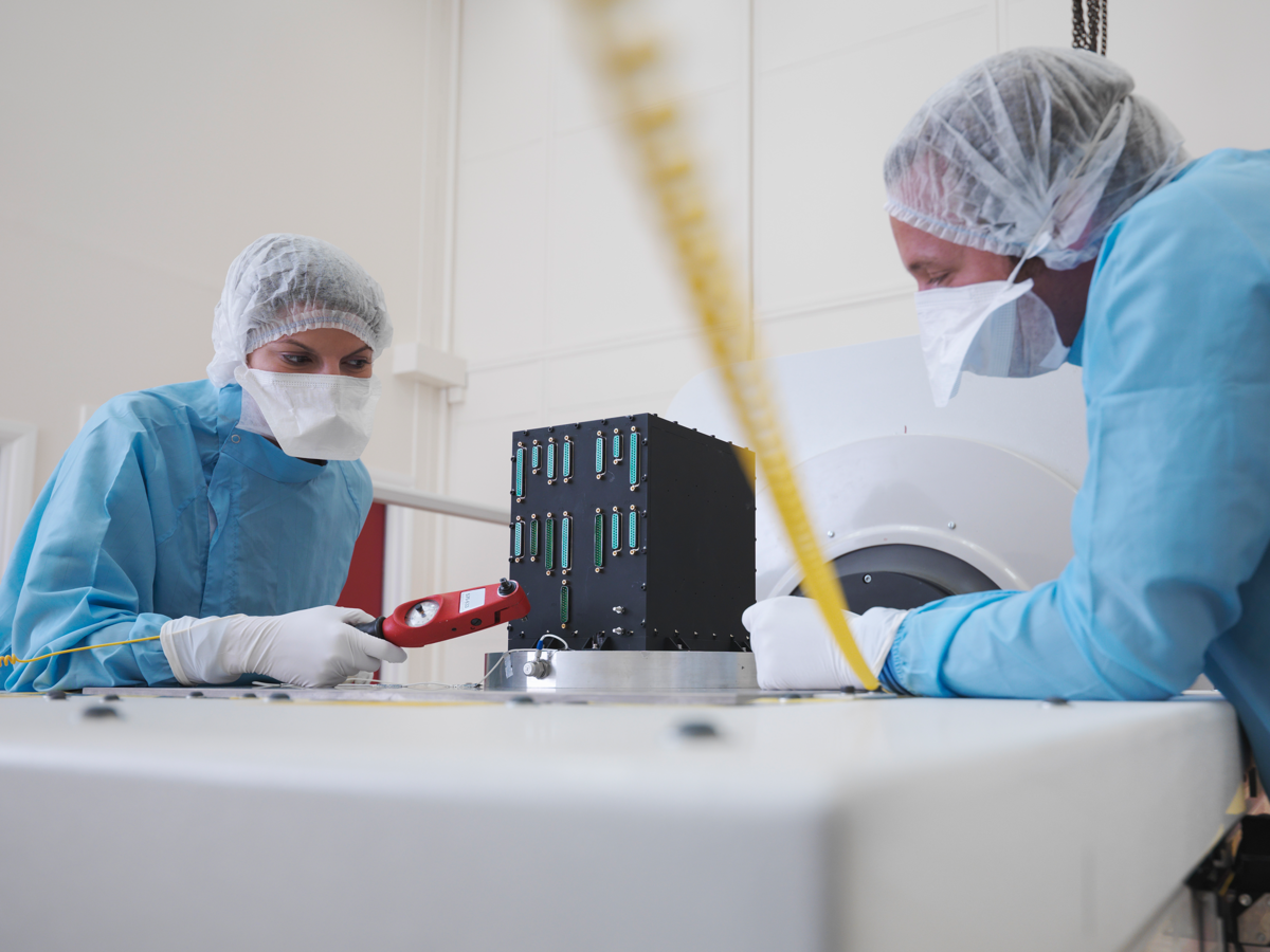 Medical technicians examine a medical device for safety