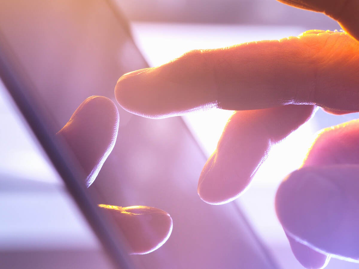 Close up of a person touching a phone
