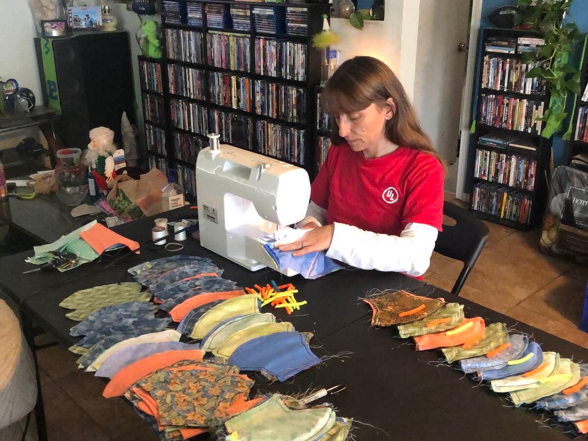 Deanna Culley sews