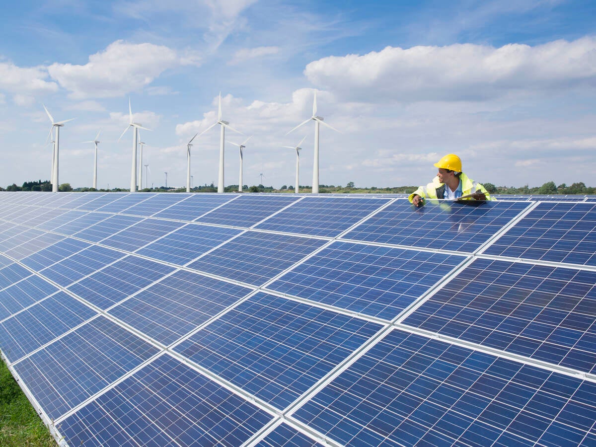 Man checking on solar panels