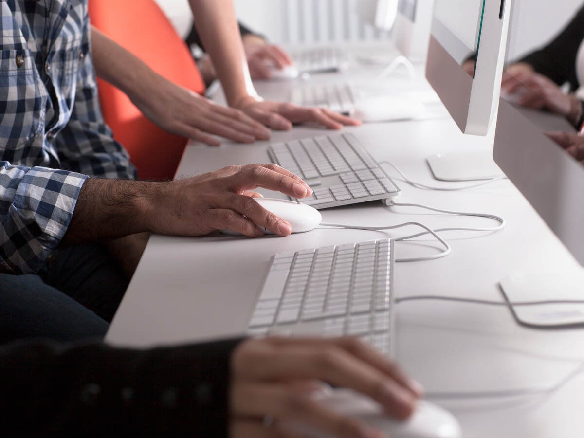 People using computers at desk