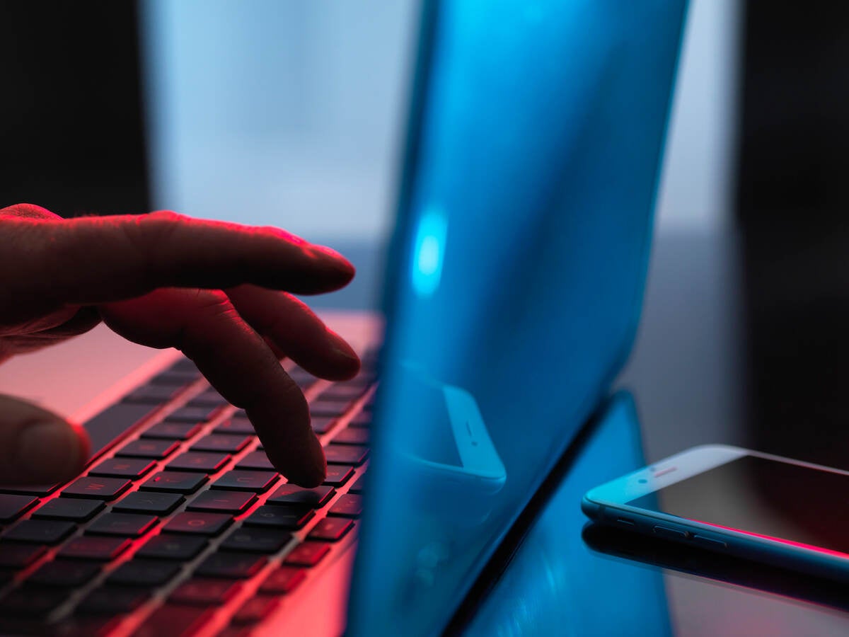 Person typing on a laptop
