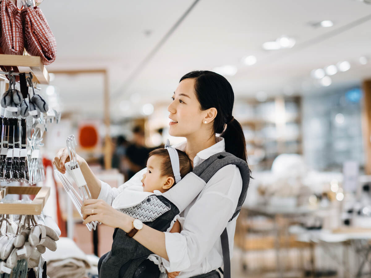 Asian women with baby shopping at department store