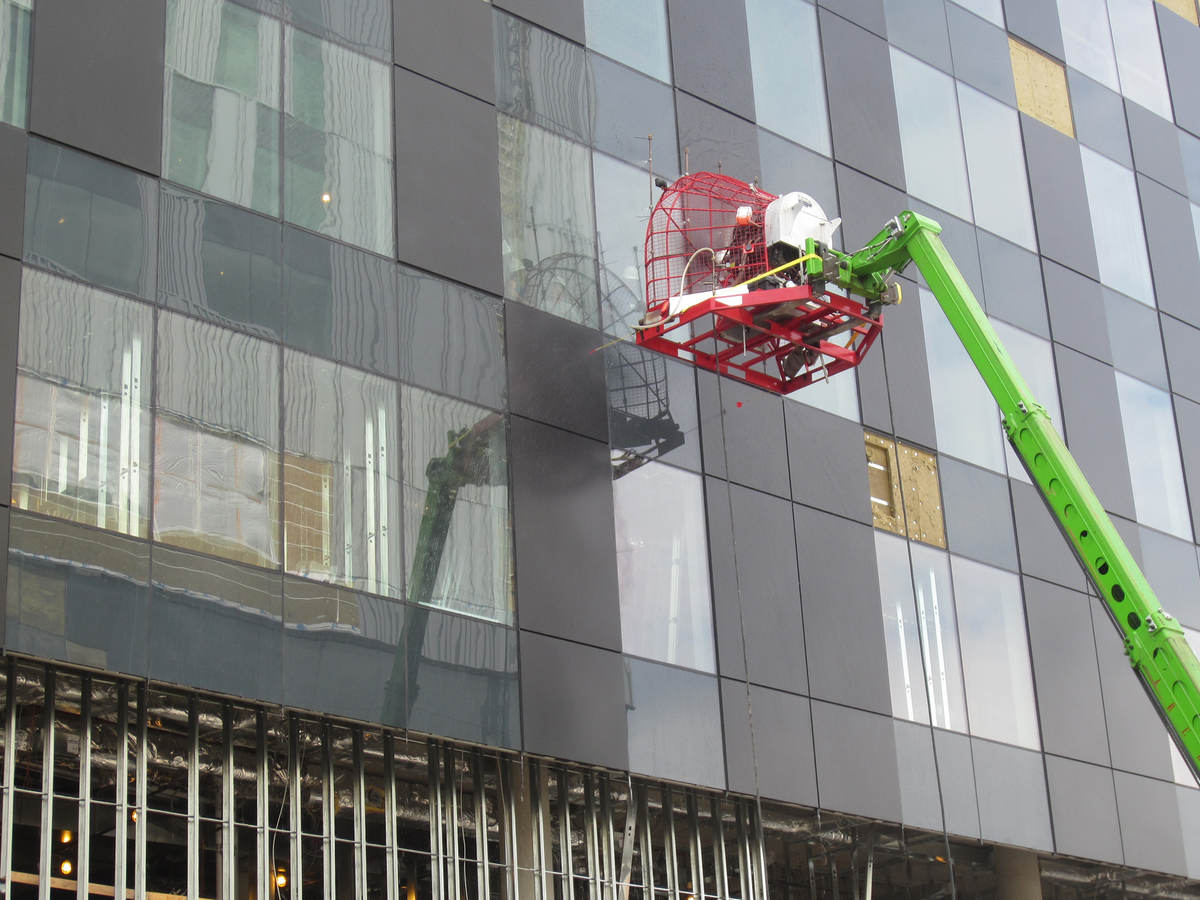 Commercial building envelope with wind load fan
