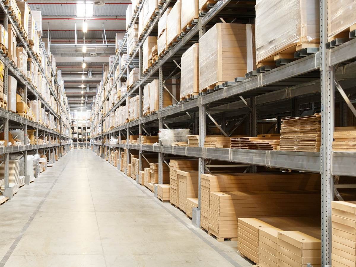 Row of shelves with boxes in warehouse