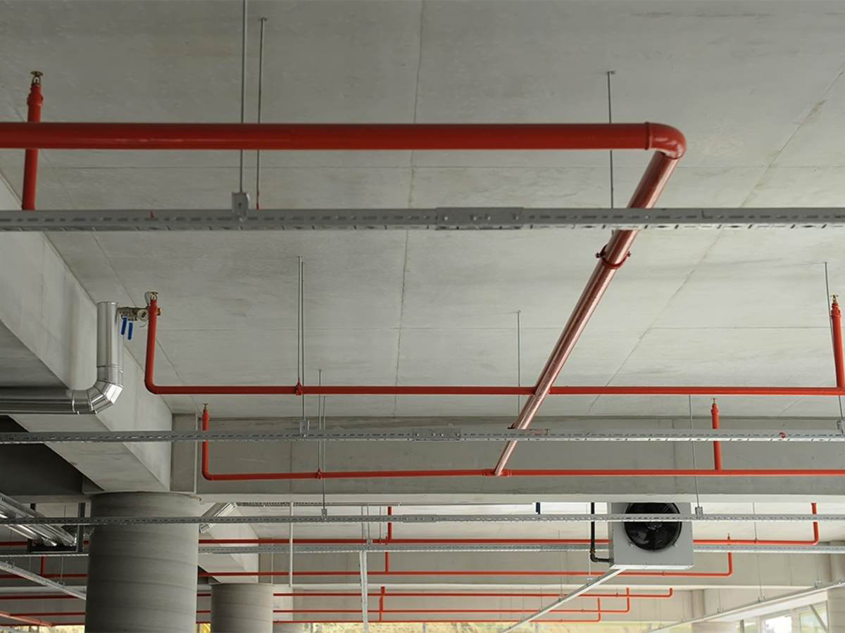 photo of pipe system along a ceiling