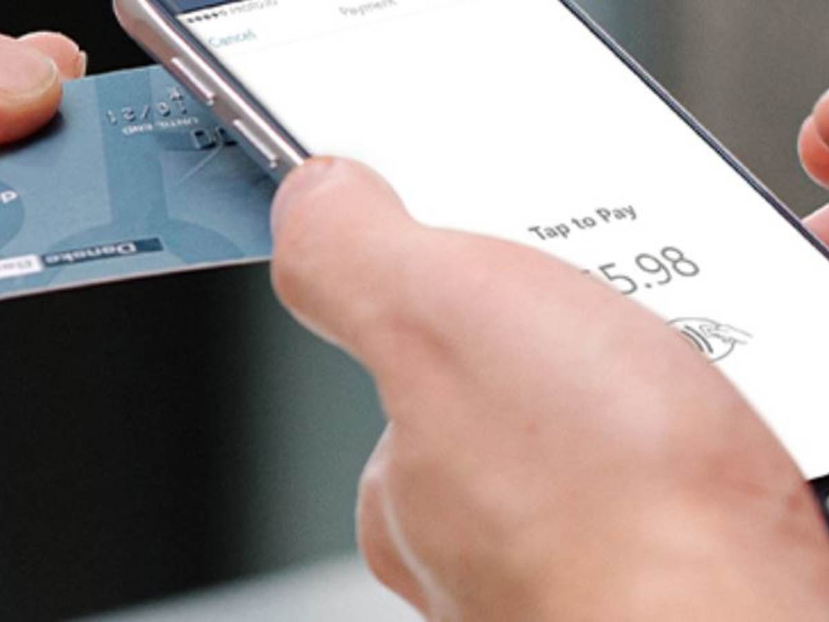 chip-enabled credit card near a smartphone