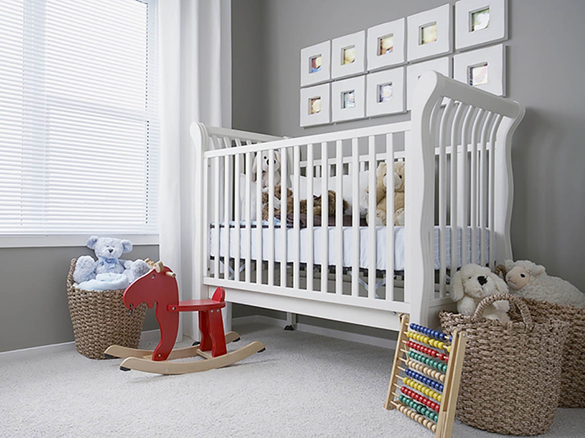 Photo of a crib and children's toys