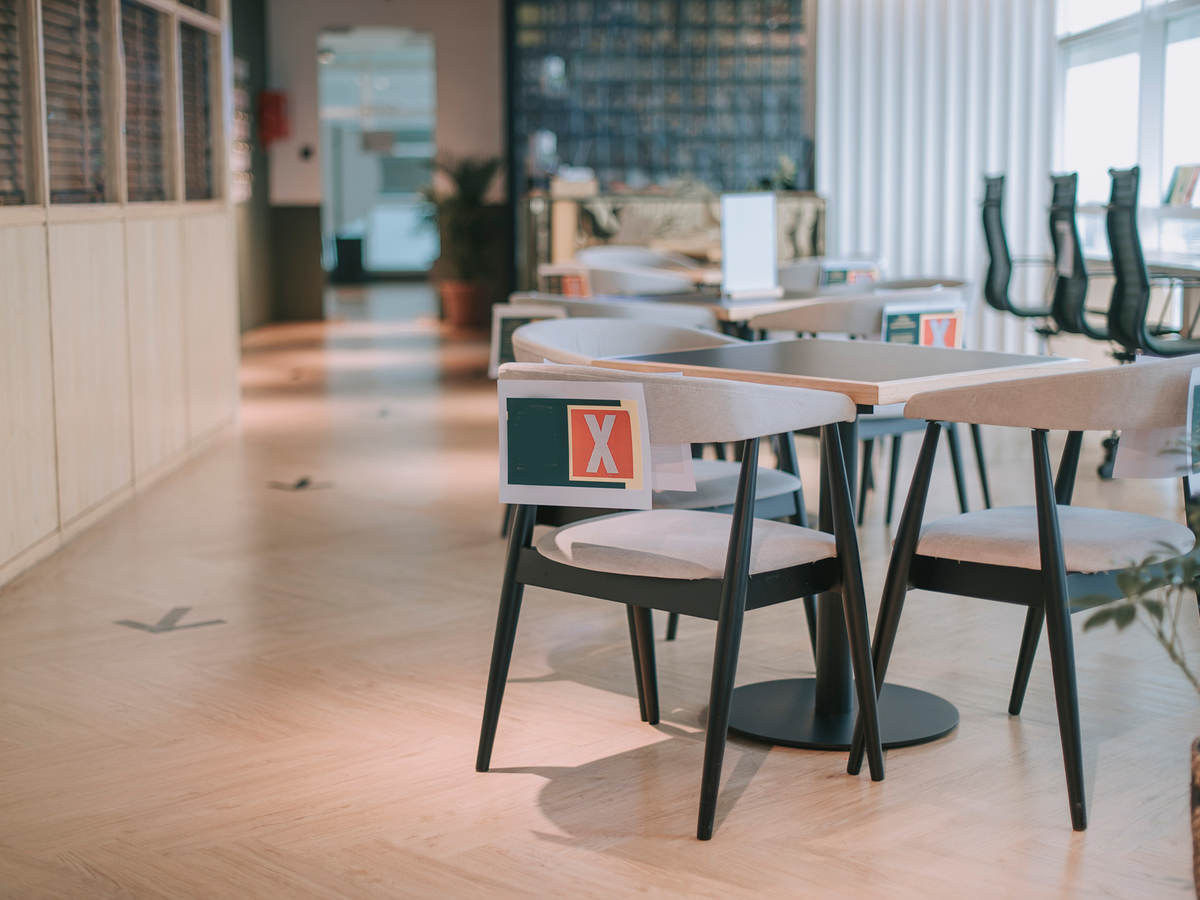 Safe workplace with socially distanced tables