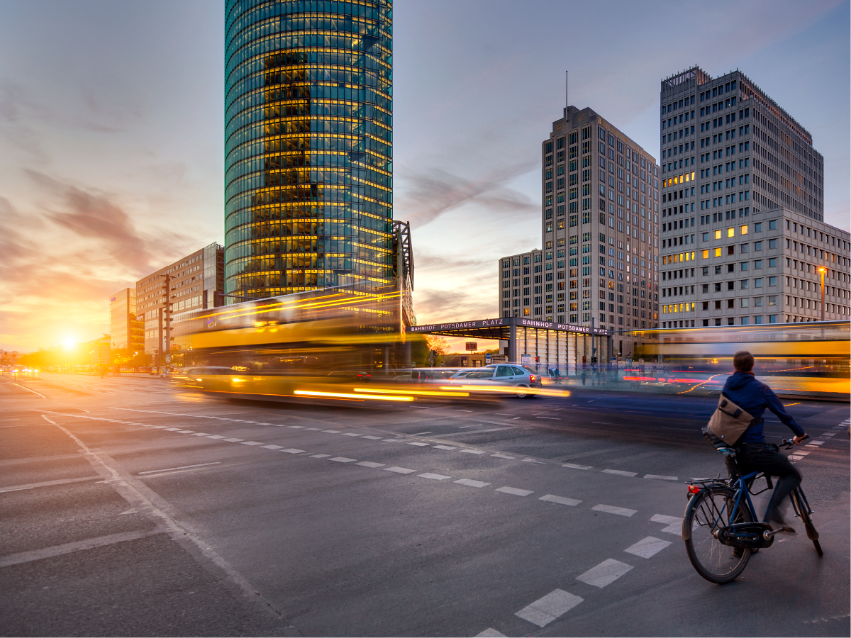 Person riding their bike in the city at dusk