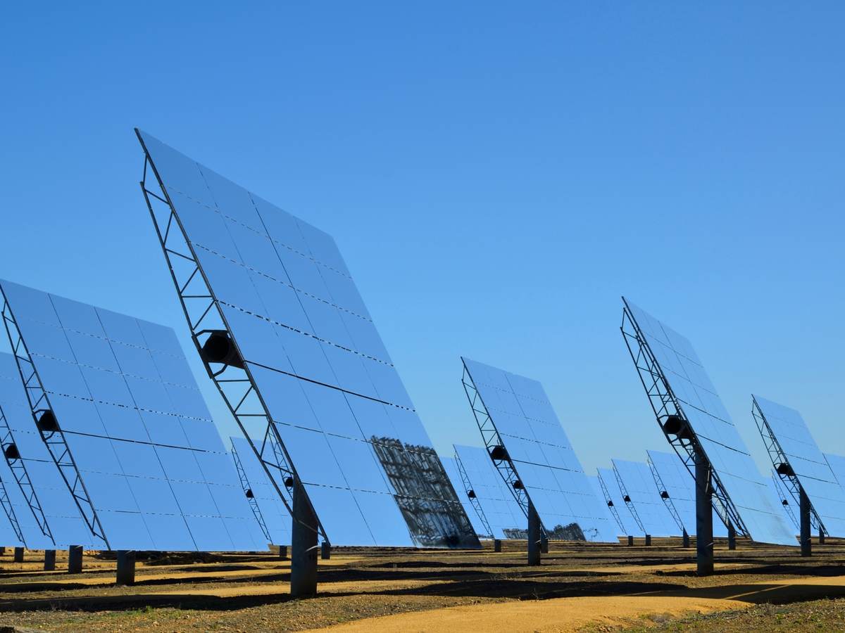 bifacial solar panels against a blue sky