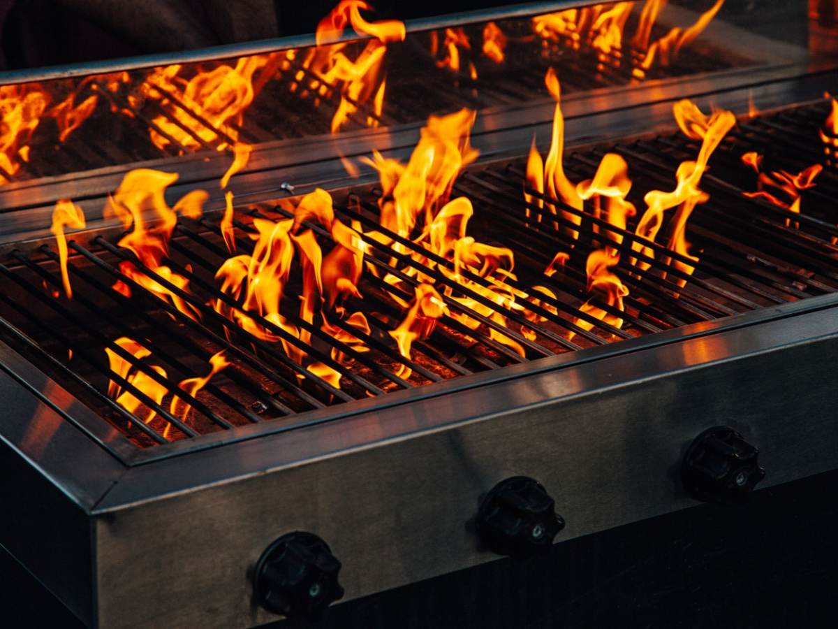 Barbecue gas grill with flames coming up 