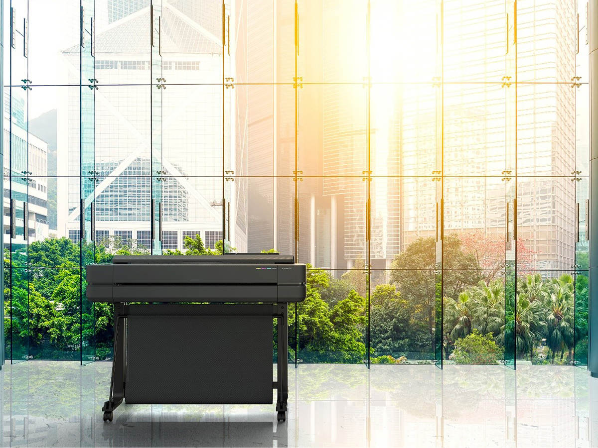 Photo of an HP Design Jet T600 in front of windows with sun shining through