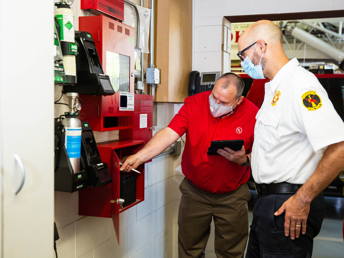 People inspecting a fire system
