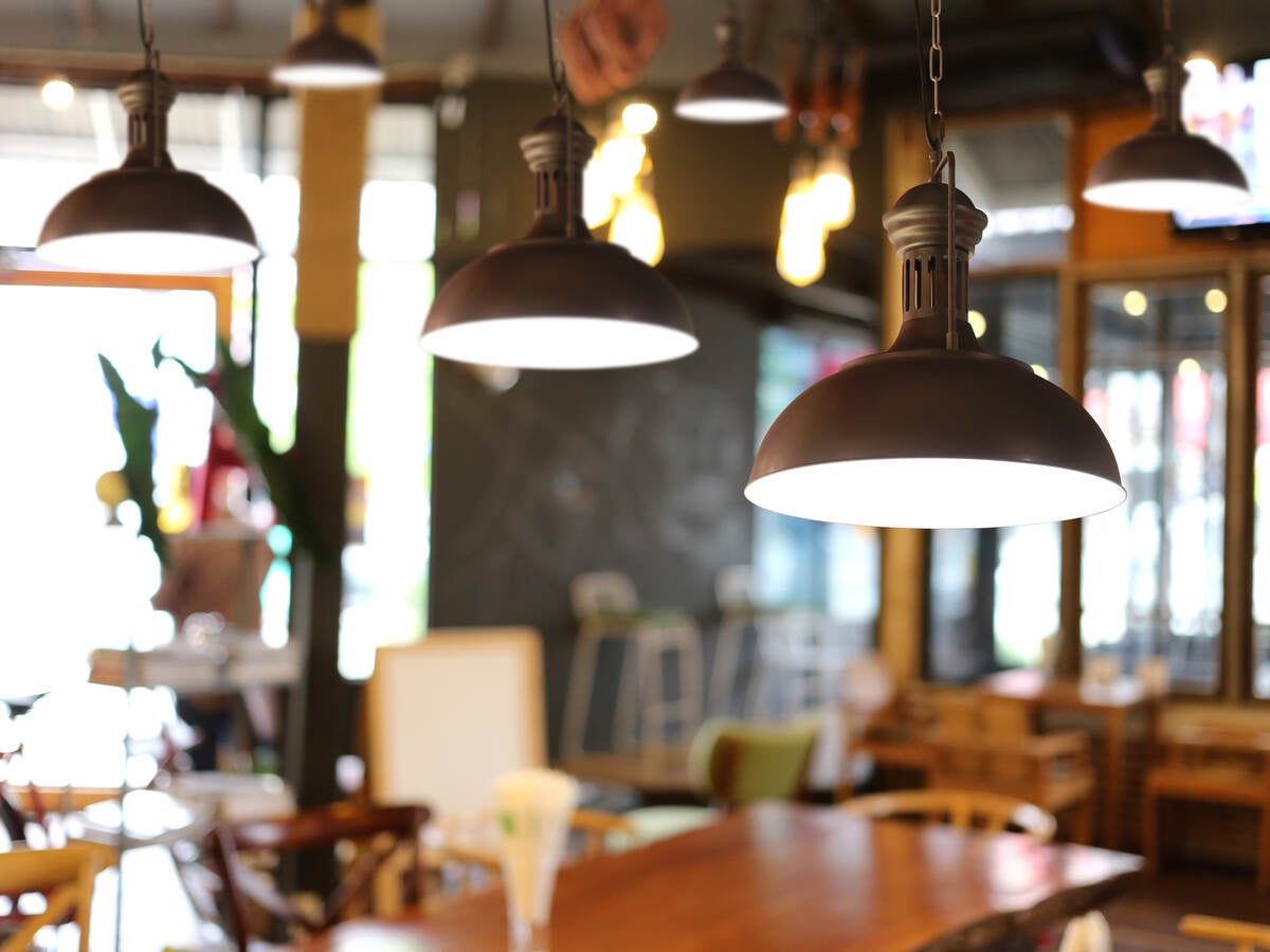 Illuminated Pendant Lights Hanging In Restaurant