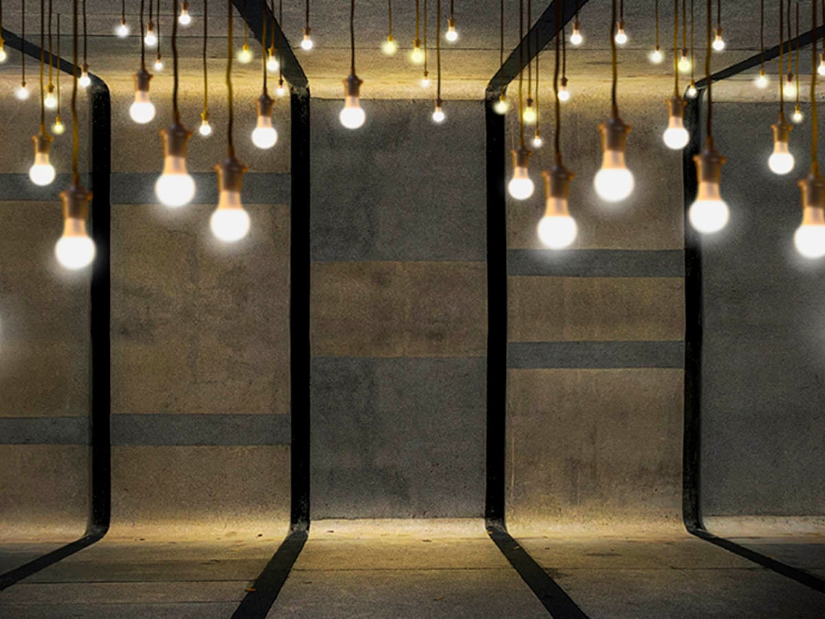 Light bulbs hanging in cement room