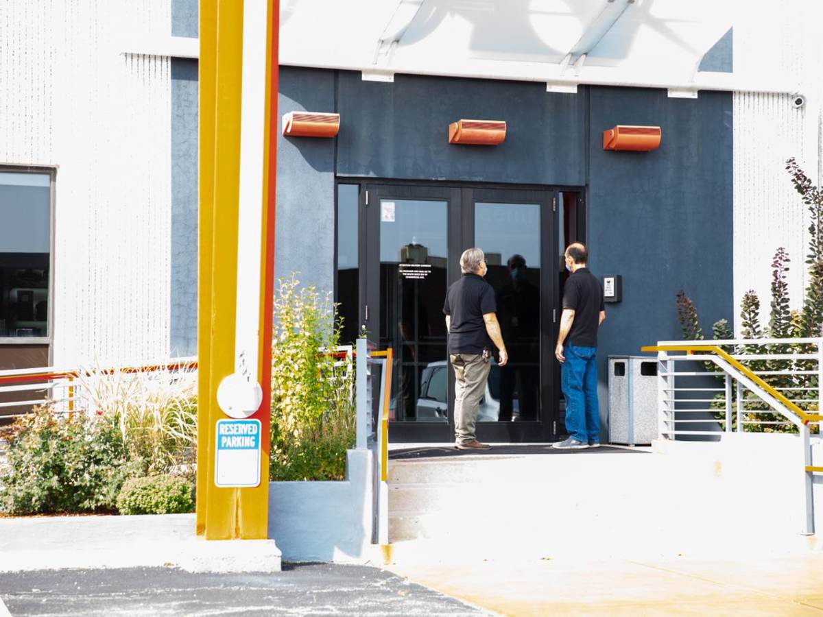 Two code authorities entering a building