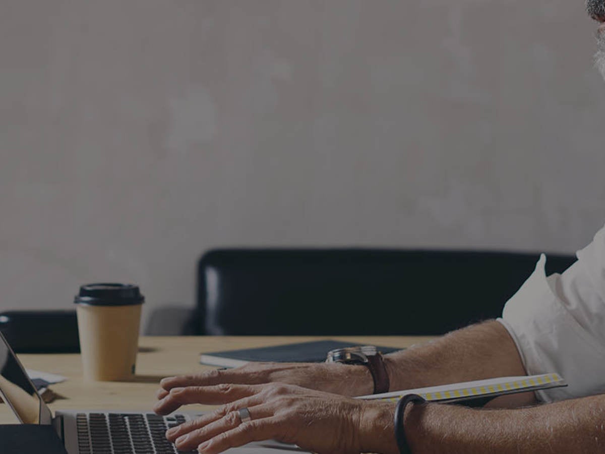 Man sitting in front of computer at a desk