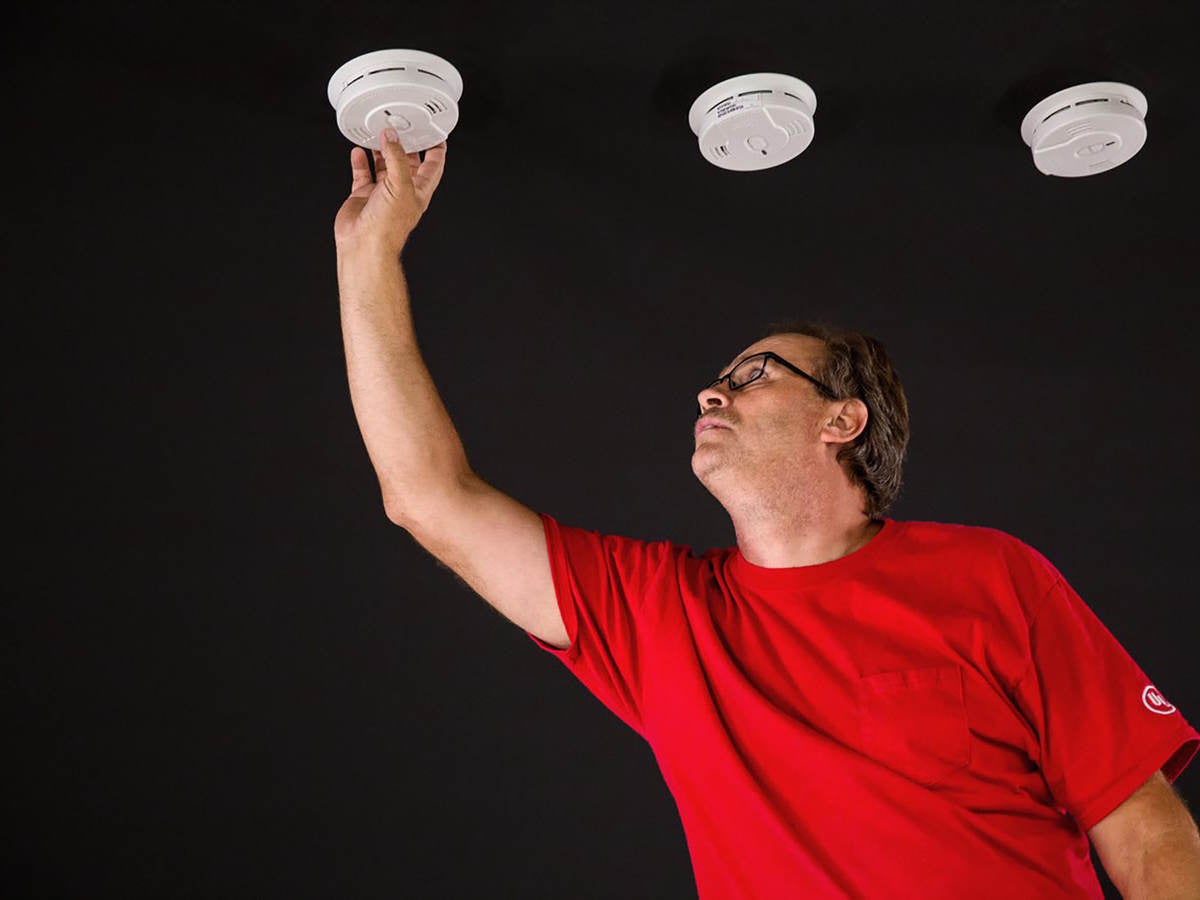 UL technician looking at smoke alarms in the laboratory