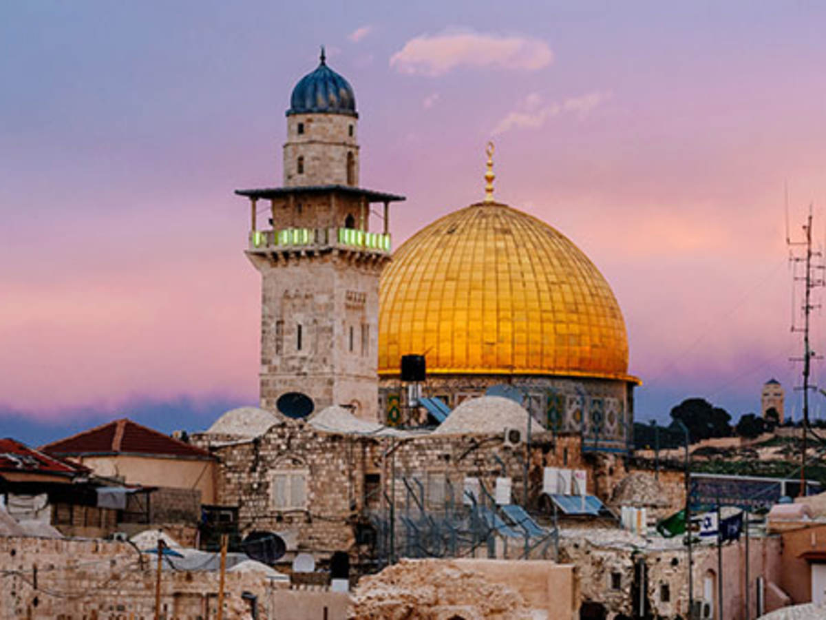 Yellow domed building behind tower