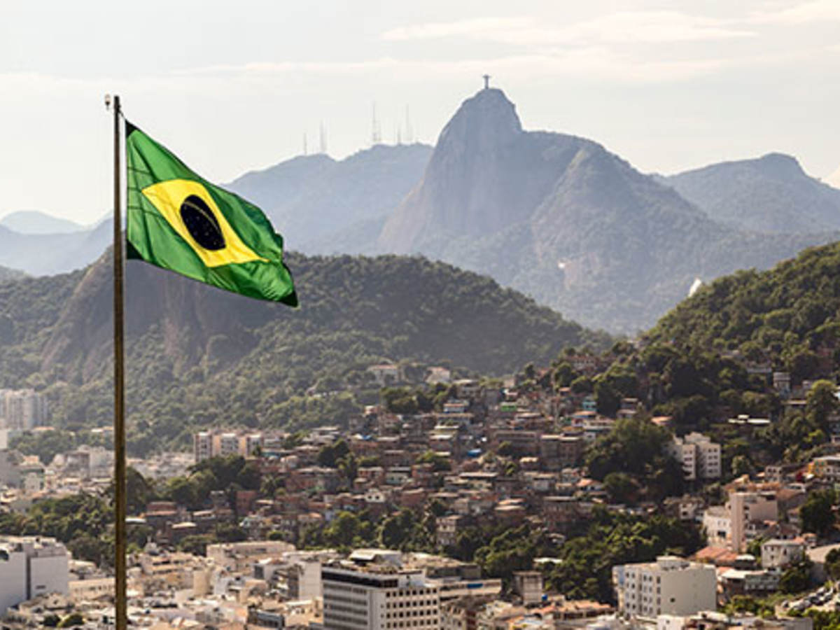 Brazilian flag flying over countryside view