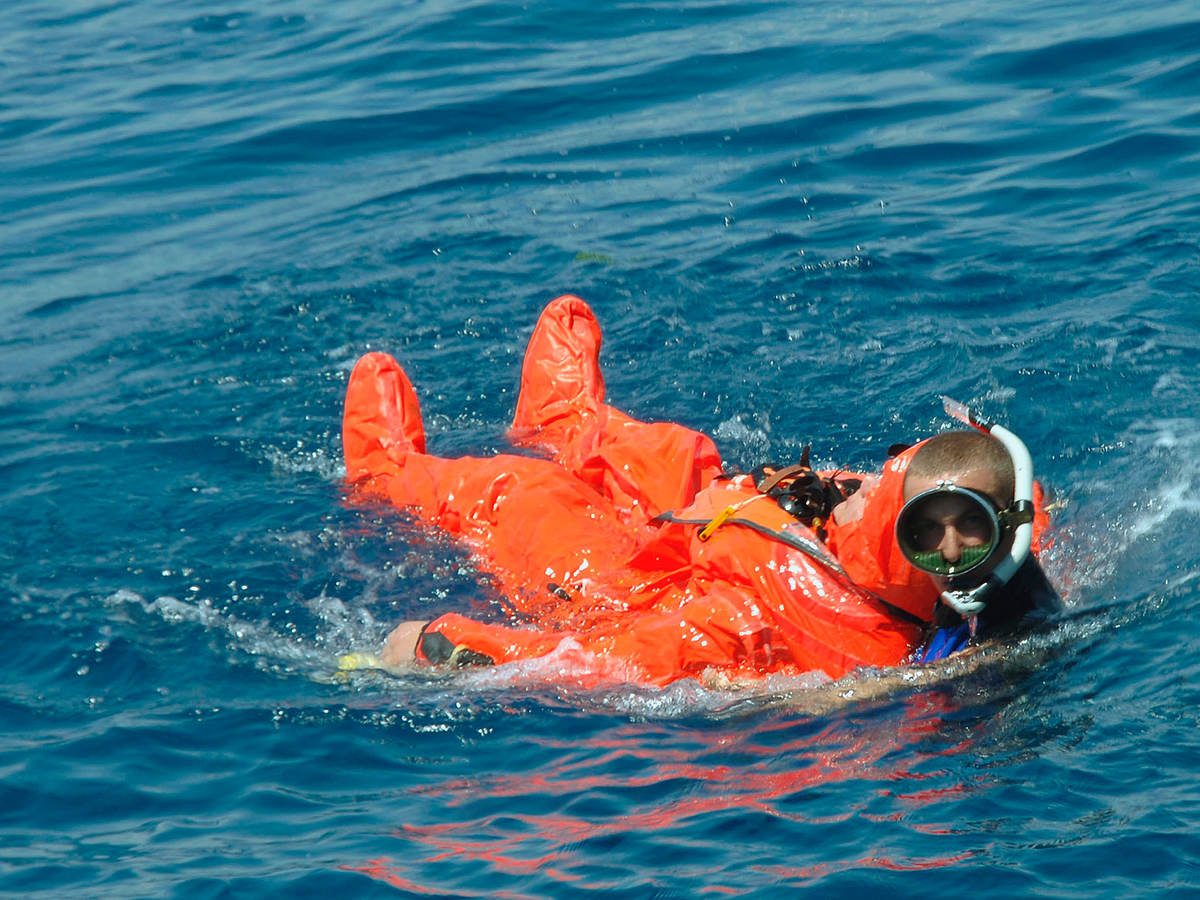 A diver rescuing a sailor