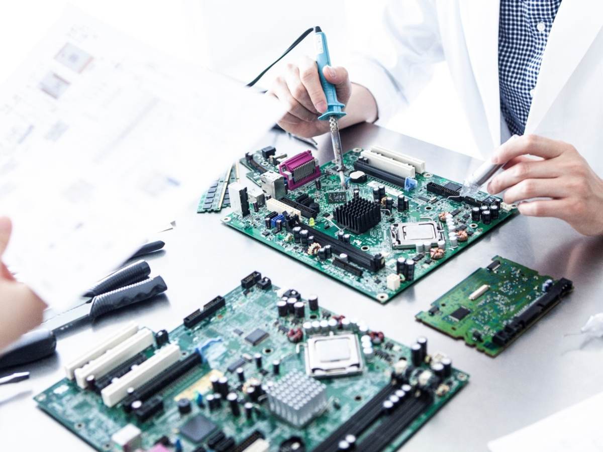 Lab tech working on electronic device
