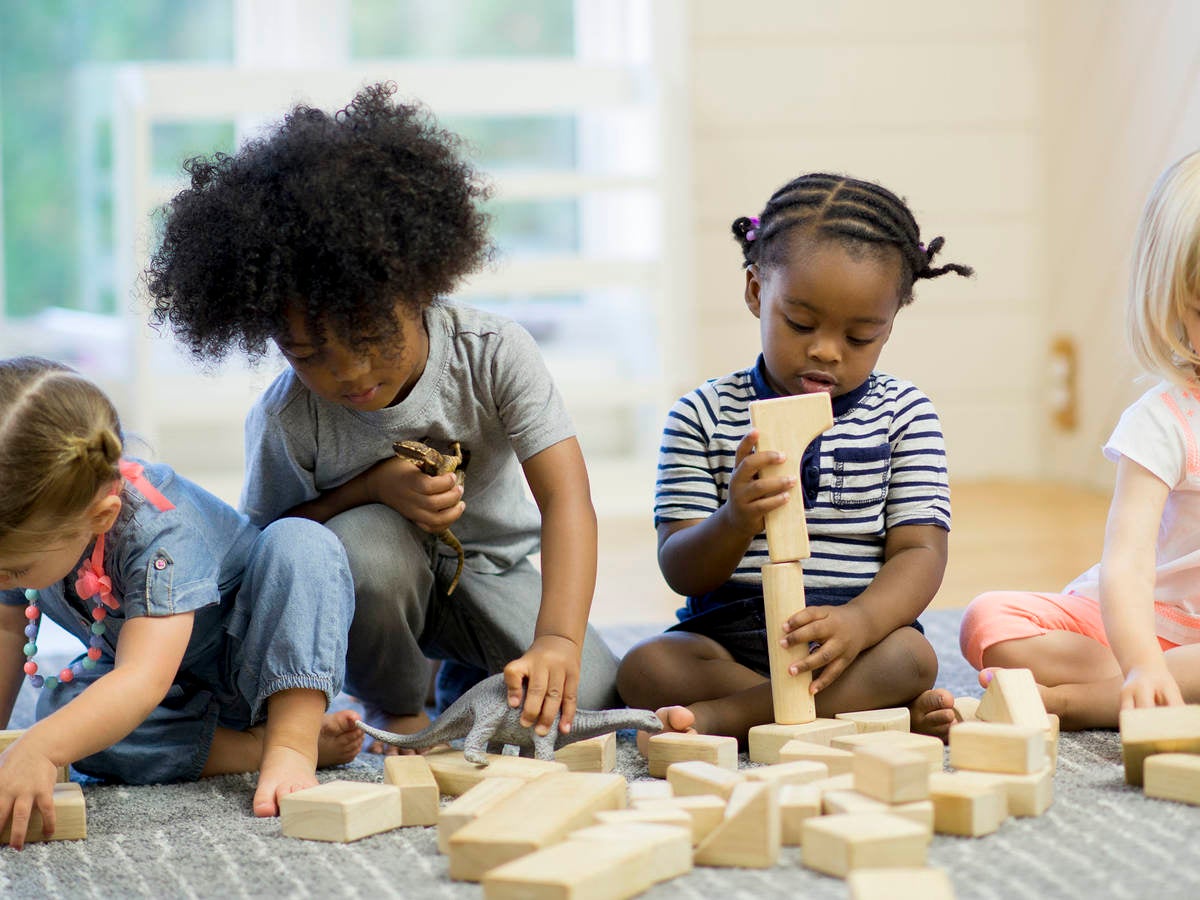 Children playing with wood blocks