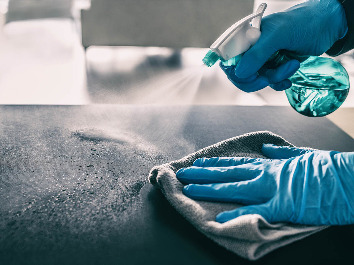 Cleaning table with spray and gloves