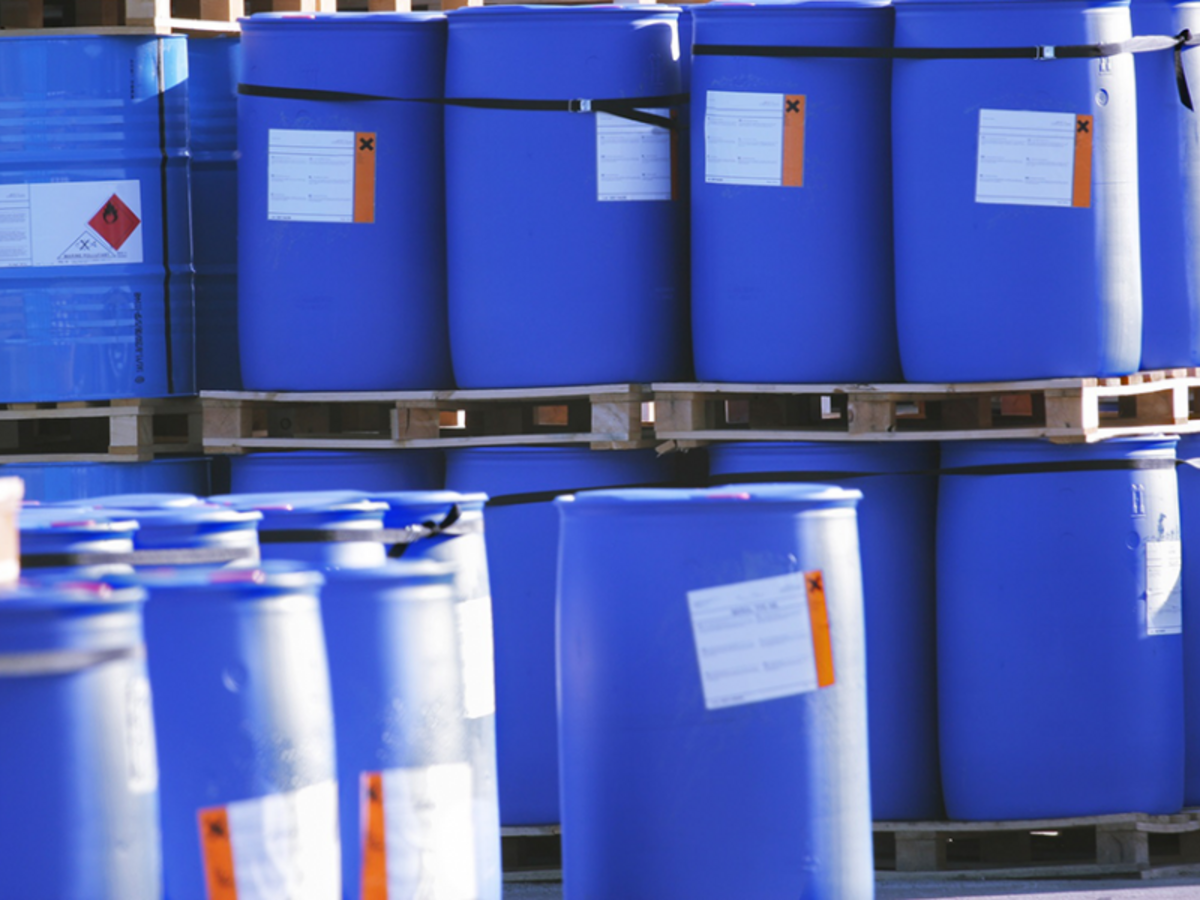 Blue Container with Labels - Automated SDS Authoring & Labeling