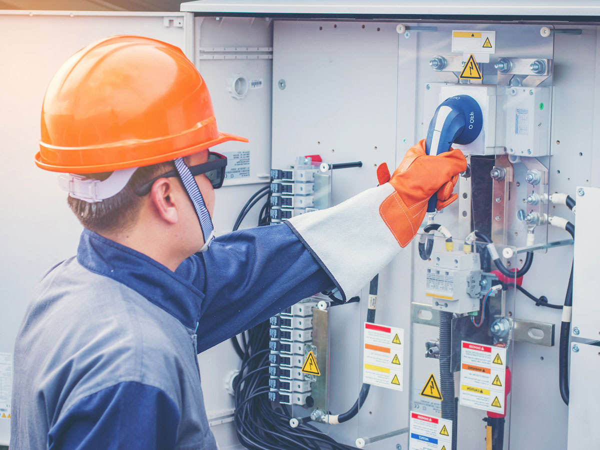 Engineer working on equipment and performing maintenance in a solar power plant