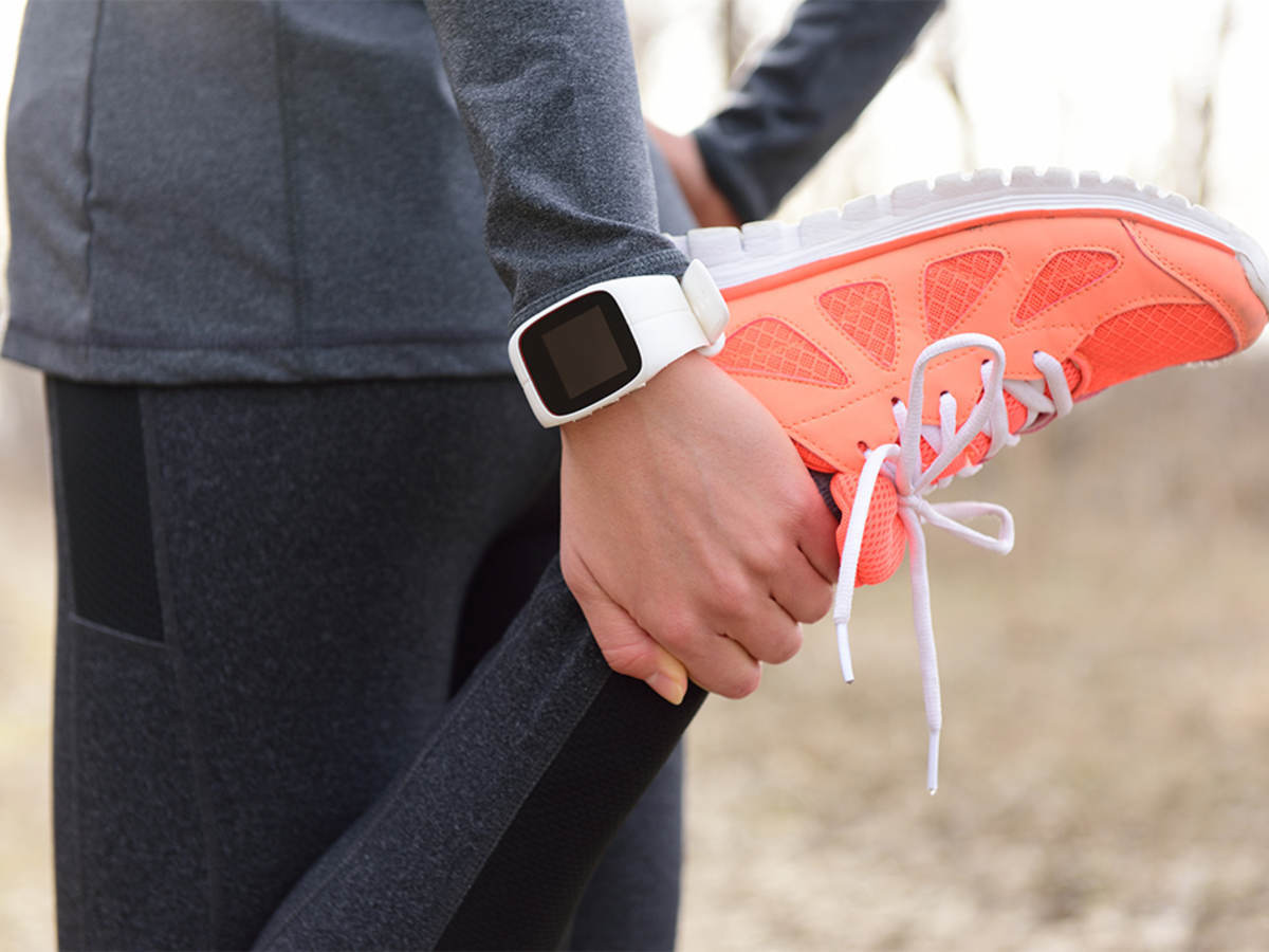 Woman in exercise clothing stretching her muscles